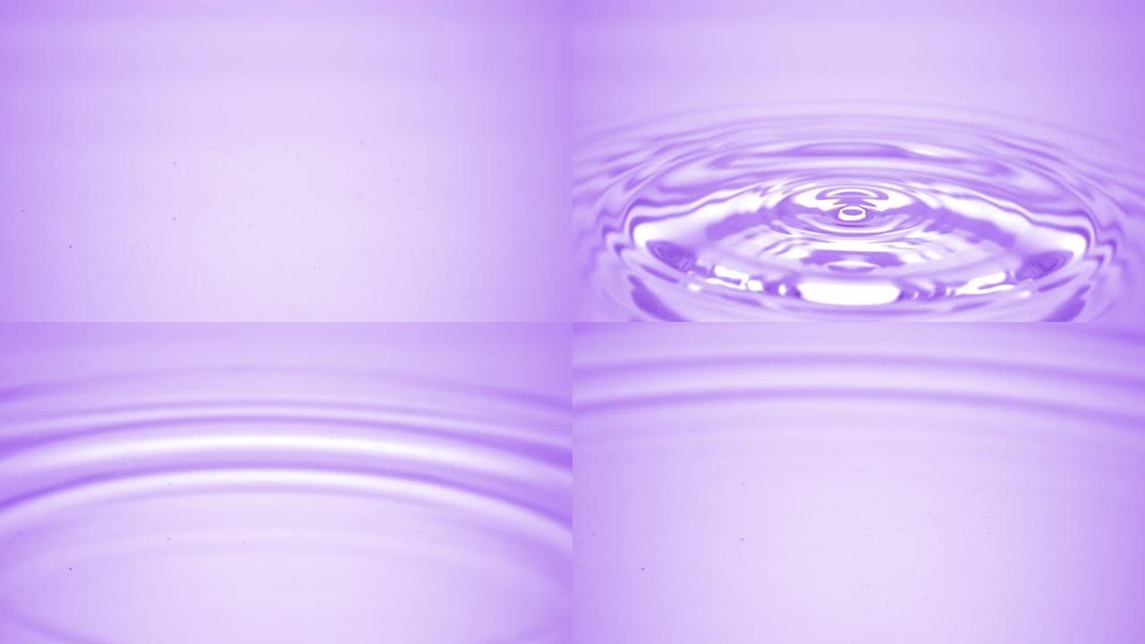 水滴落在紫色流体表面，形成水环