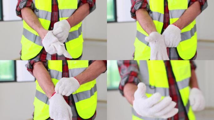 慢动作VDO。男子建筑工人戴着安全手套，准备工作。建筑业概念。