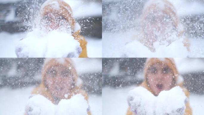 女孩从手中吹雪