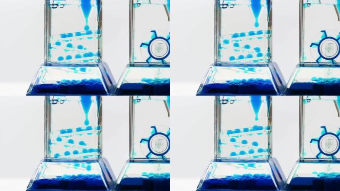复杂蓝色流体沙漏机，时间流概念，液体滴，下落抽象，物体特写，没人。时间不多了，流体和液体物理学，近距
