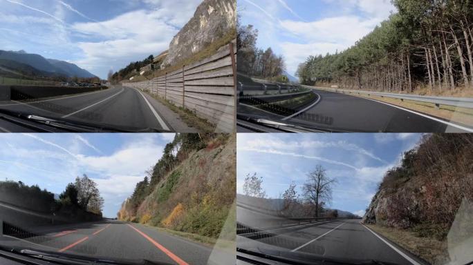 奥地利欧洲高速公路上的驾驶员视点，从车内行驶，带自然森林景观树和山地