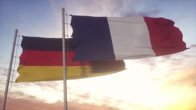 德国和法国国旗插在旗杆上。德国和法国的旗帜在风中飘扬。德国和法国的外交理念