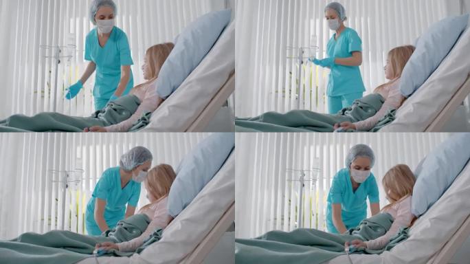 护士为生病的孩子躺在床上并在病房里滴水