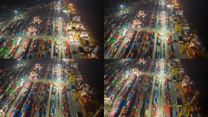 鸟瞰图无人机在泰国曼谷的工业港口上空延时或超延时，许多集装箱船和大型起重机在夜间工作。