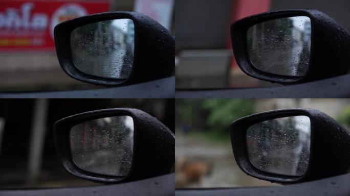 在雨天打开车窗看侧镜。