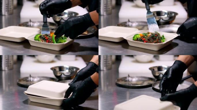 厨师在行动，将鱼放入盘子。
