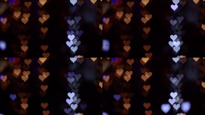 情人节4K UHD视频背景。黑色背景上浪漫闪耀、闪烁的心的波克。爱，心状的波克。