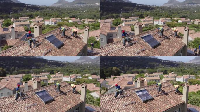 安装在房屋屋顶上的太阳能电池板的4k无人机镜头