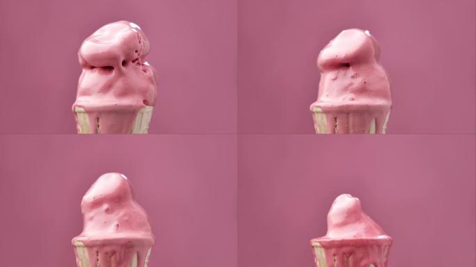草莓冰淇淋融化在粉红色背景上。冰淇淋融化的延时。