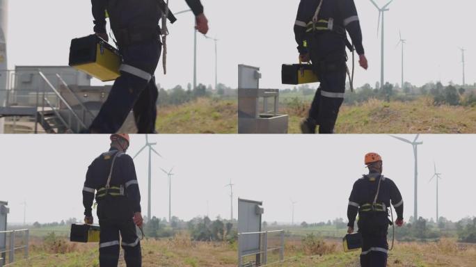 统一检查工程师在泰国风电场中准备和进度检查具有安全性的风力涡轮机。