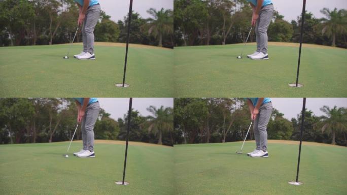 4k亚洲男子高尔夫球将高尔夫球通过球道上的一个洞