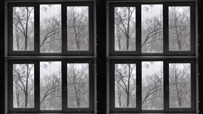 冬季降雪穿过白色窗户和玻璃