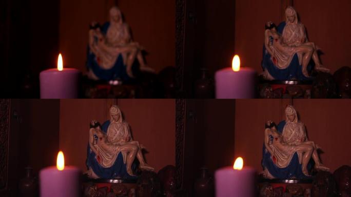 2017年3月13日，雅加达: 背景为Pieta雕像的明亮蜡烛的视频片段