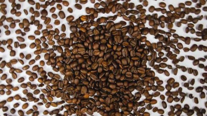 咖啡豆旋转迅速快速飞行，分解，用离心科里奥利力飞溅到侧面。咖啡豆扭曲，创造图案