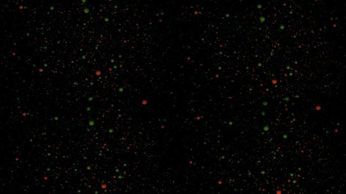 黑色背景上的圆形五彩球，银色亮片。红色和绿色颗粒随机移动。