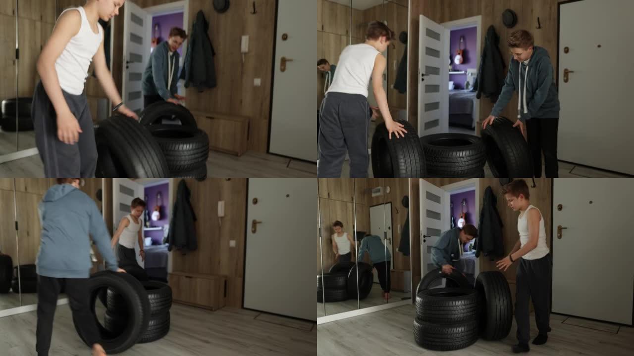 十几岁的男孩在现代公寓大厅里玩轮胎