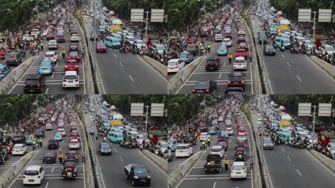 印度尼西亚雅加达。2017年8月14日: 雅加达卡萨布兰卡路交通高峰时段的录像，拥挤的汽车和摩托车