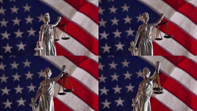 背景为美国国旗的翻板上的女士正义雕像