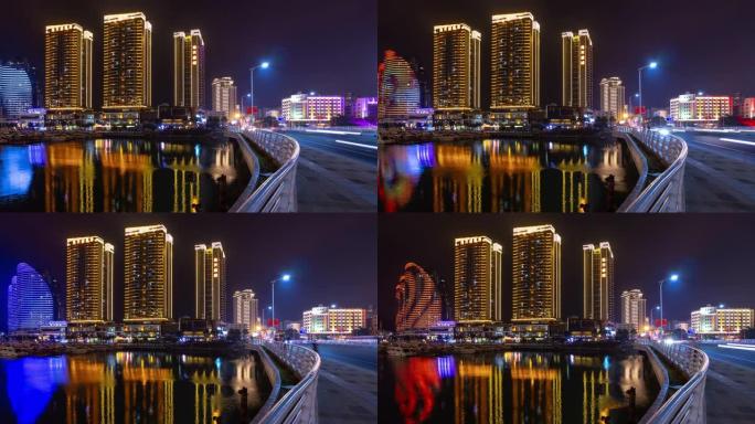 夜间照明三亚交通街大桥公寓综合全景4k海南岛中国