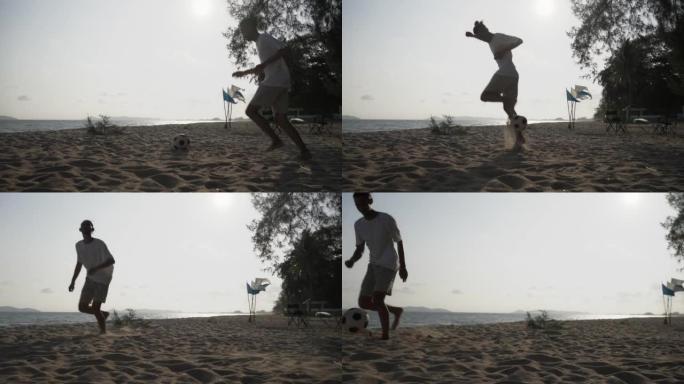 亚洲男子在海滩上踢足球。