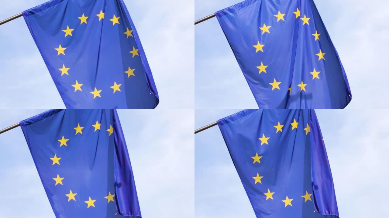欧盟旗帜，欧盟符号部分近看，12颗星星旗帜物体细节，近看，背景是晴朗的天空，没有人。政治、经济、商业