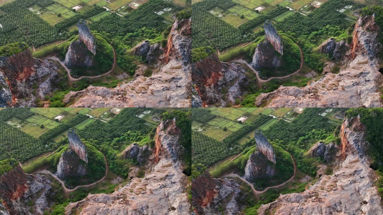 宋卡府奇怪形状山Khao Kuha的空中无人机日出场景。有绿色林木的山。泰国的自然景观背景。黄山。