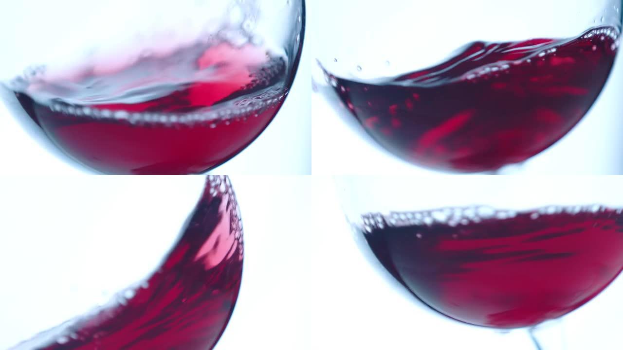 在散焦背景上在玻璃杯中挥舞红酒。美丽的葡萄酒广告素材。高脚杯内葡萄酒混合过程的特写视频。慢动作在阿瑞