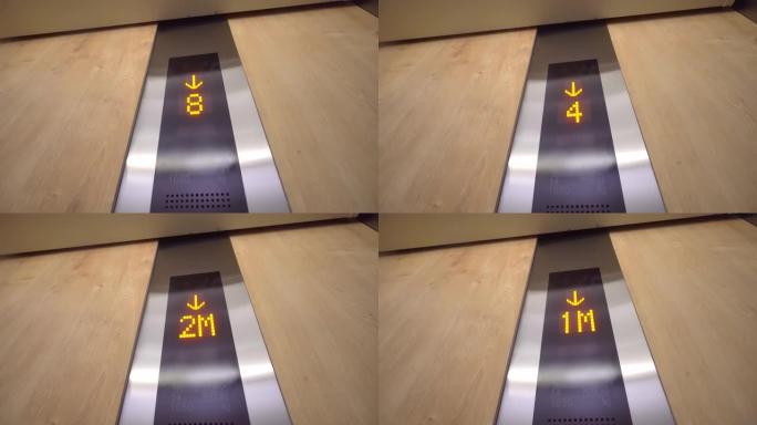 带有向下箭头的电梯中的数字显示屏显示楼层。