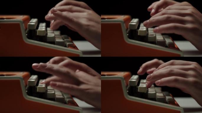 人的手在复古打字机特写上打字，手指按下黑色背景上老式打字机键盘的按钮