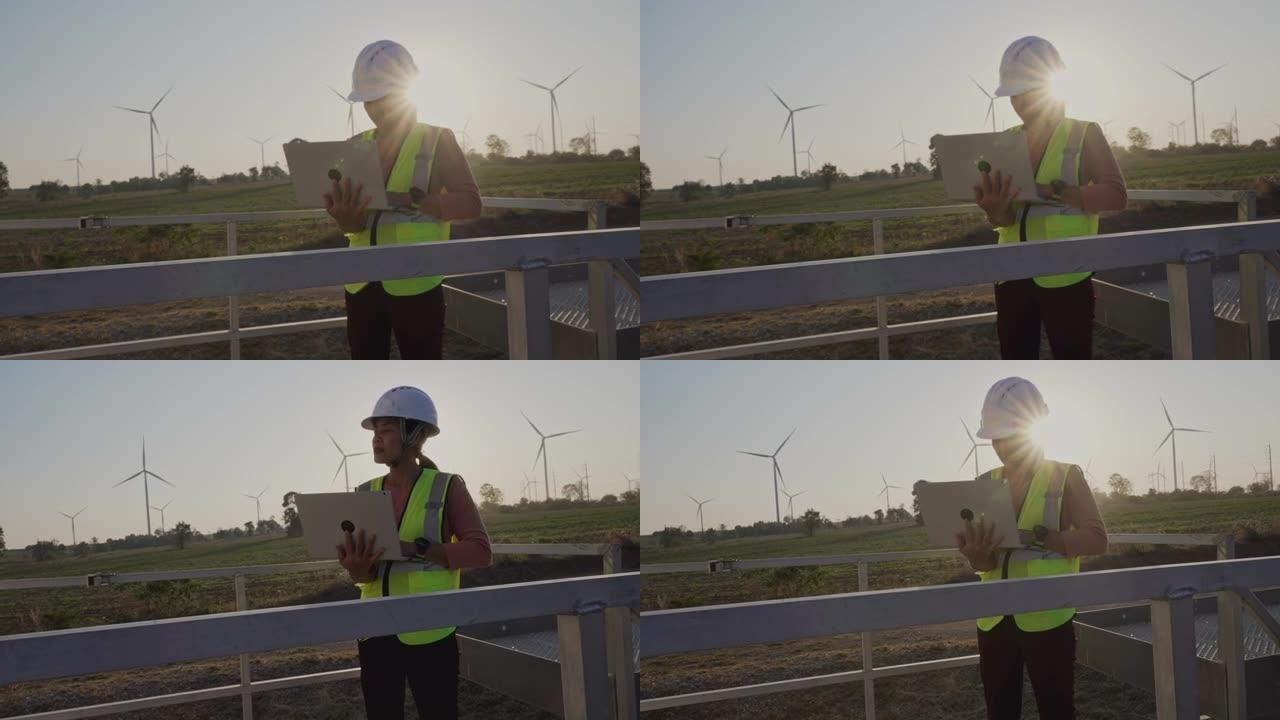在风车领域的能源行业工作的女工程师。