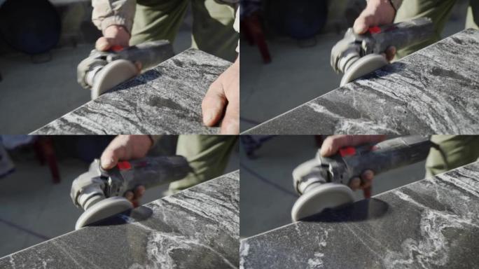 用研磨机研磨花岗岩石材。