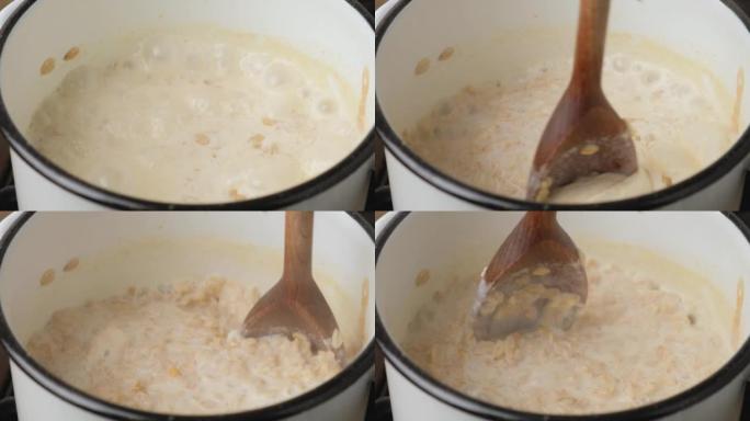 在锅中煮燕麦片煮粥，然后用木勺搅拌。健康早餐