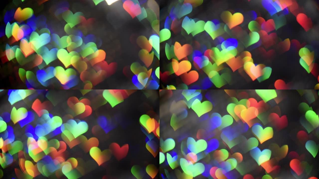 4k光泄漏作为彩虹心镜头bokeh抽象移动。