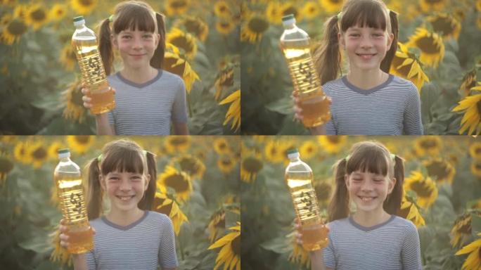 这个女孩拿着一瓶植物油，带着向日葵站在田野里。农业、有机健康食品