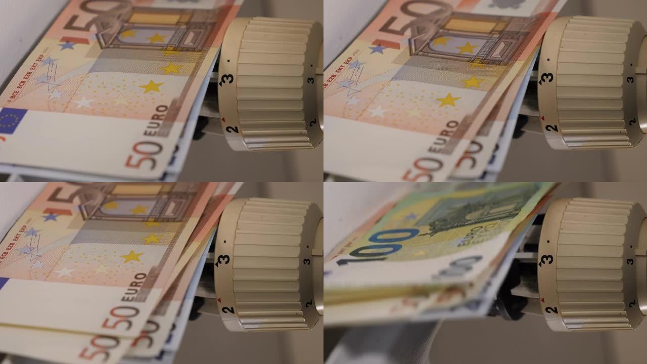 将欧元放在散热器上，显示出高能耗的概念。钱