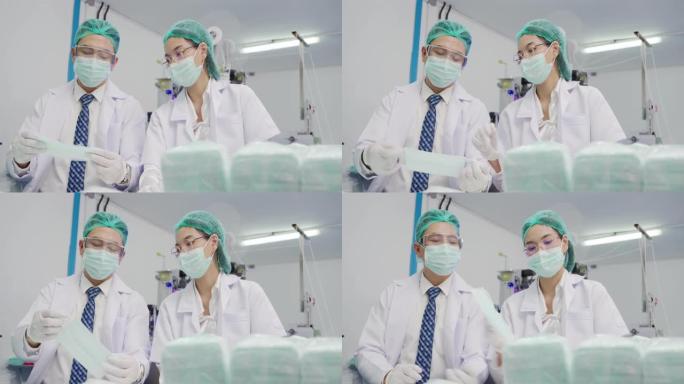 口罩工厂与机器安装技术人员检查工作系统，以生产符合世界卫生标准的工件。