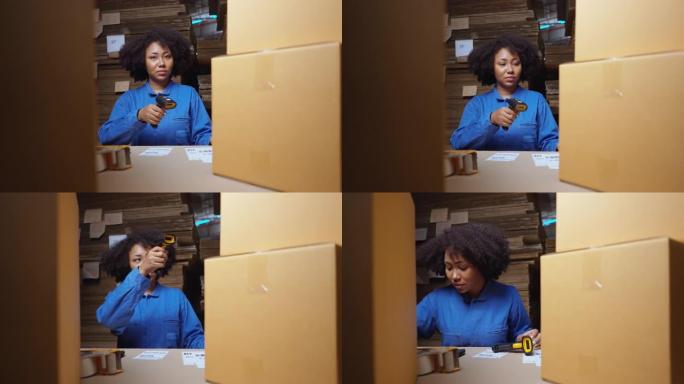 物流公司仓库中穿着蓝色连身衣的非洲年轻女子检查标签并准备产品以交付给客户，检查清单，使用条形码扫描仪