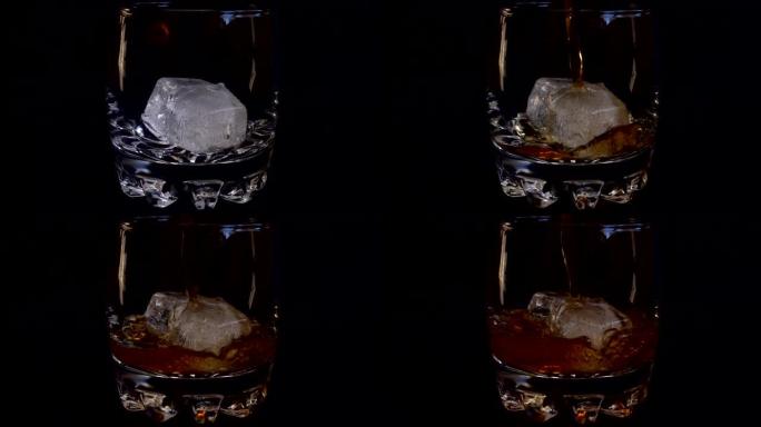 在孤立的黑色背景上将威士忌倒入加冰的玻璃杯中。慢动作。