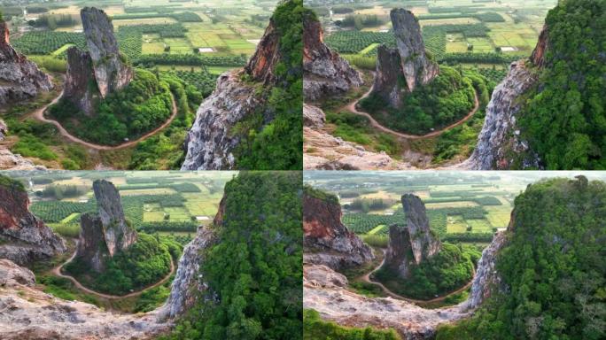 宋卡府奇怪形状山Khao Kuha的空中无人机日出场景。有绿色林木的山。泰国的自然景观背景。黄山。