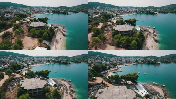 鸟瞰图蓝色海滩，带空日光浴躺椅，巴尔干海岸爱奥尼亚海阿尔巴尼亚