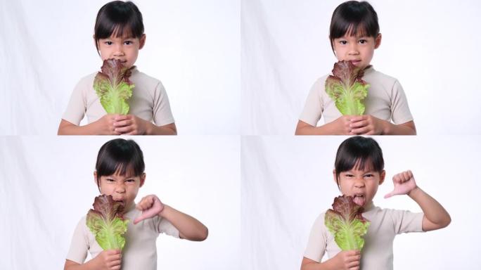 孩子们不喜欢吃蔬菜。讨厌吃绿色沙拉的小女孩。