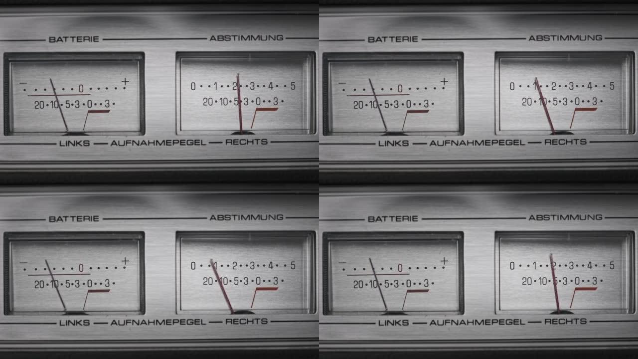 银色磁带录音机上的两个模拟VU仪表，箭头指示器
