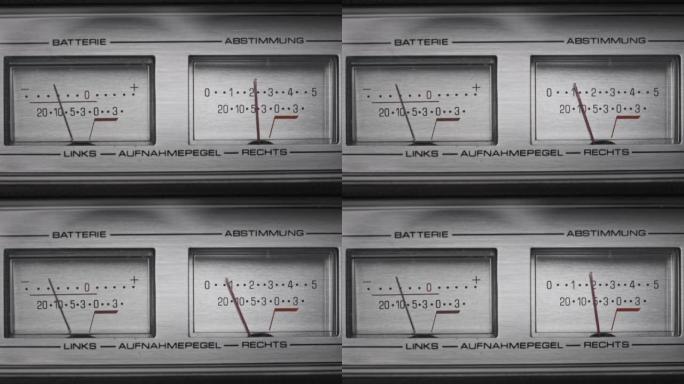 银色磁带录音机上的两个模拟VU仪表，箭头指示器