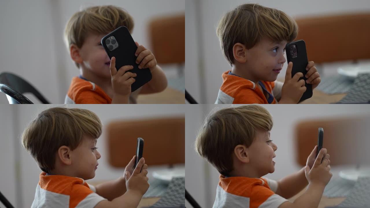 孩子用手机拍照孩子拿着智能手机拍照