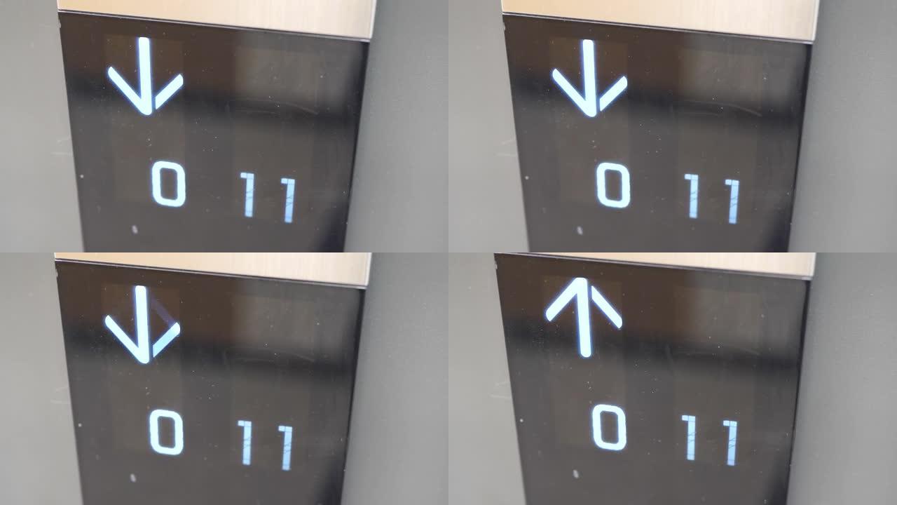 尘土飞扬的电梯面板上的箭头标志更改