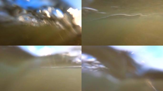 在海滩上飞溅波浪。海浪溅起相机。从低角度拍摄动作相机。