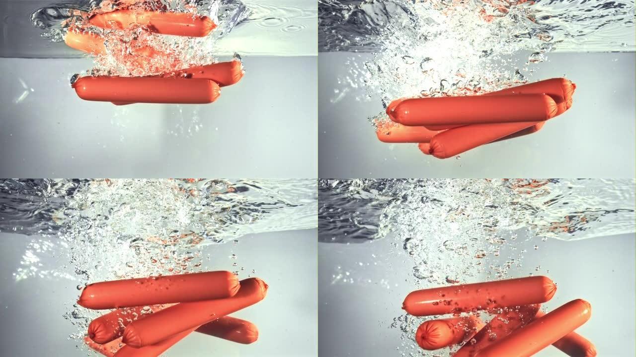 香肠随着气泡落在水下。以1000 fps的高速相机拍摄。