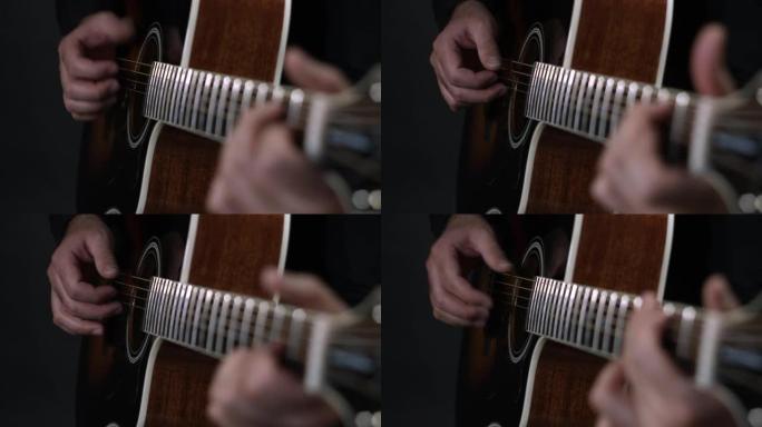 音乐家用手指弹拨技术演奏原声吉他。