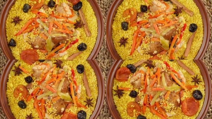 摩洛哥美食顶视图。Tajine，由羊肉和茄子制成的传统菜肴。中东文化。蒸粗麦粉配羊肉，美味的米饭。自