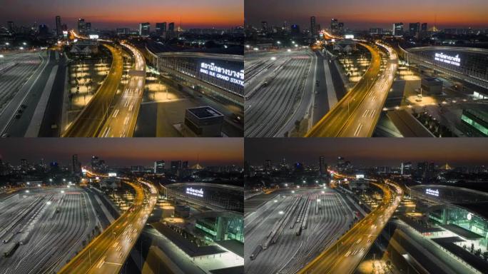 空中无人机超延时日落场景邦苏大站高速公路上有交通车灯，邦苏大站是泰国曼谷一个新的铁路枢纽，有快速列车